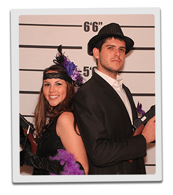 Dallas Murder Mystery party guests pose for mugshots