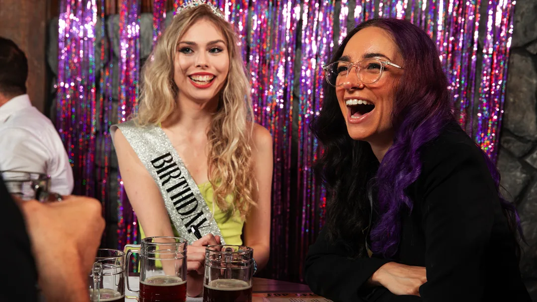 Guests celebrating at a Dallas murder mystery party